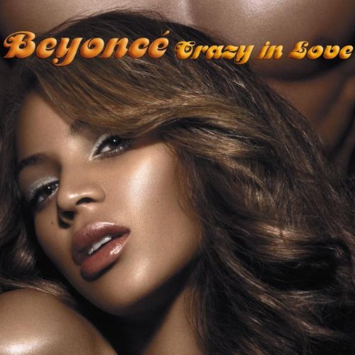 Close-up of a woman with wavy hair and a glossy lip, positioned in front of another person’s chest. Text at the top reads "Beyoncé Crazy in Love" in gold letters. The image is the album cover for Beyoncé's song "Crazy in Love.