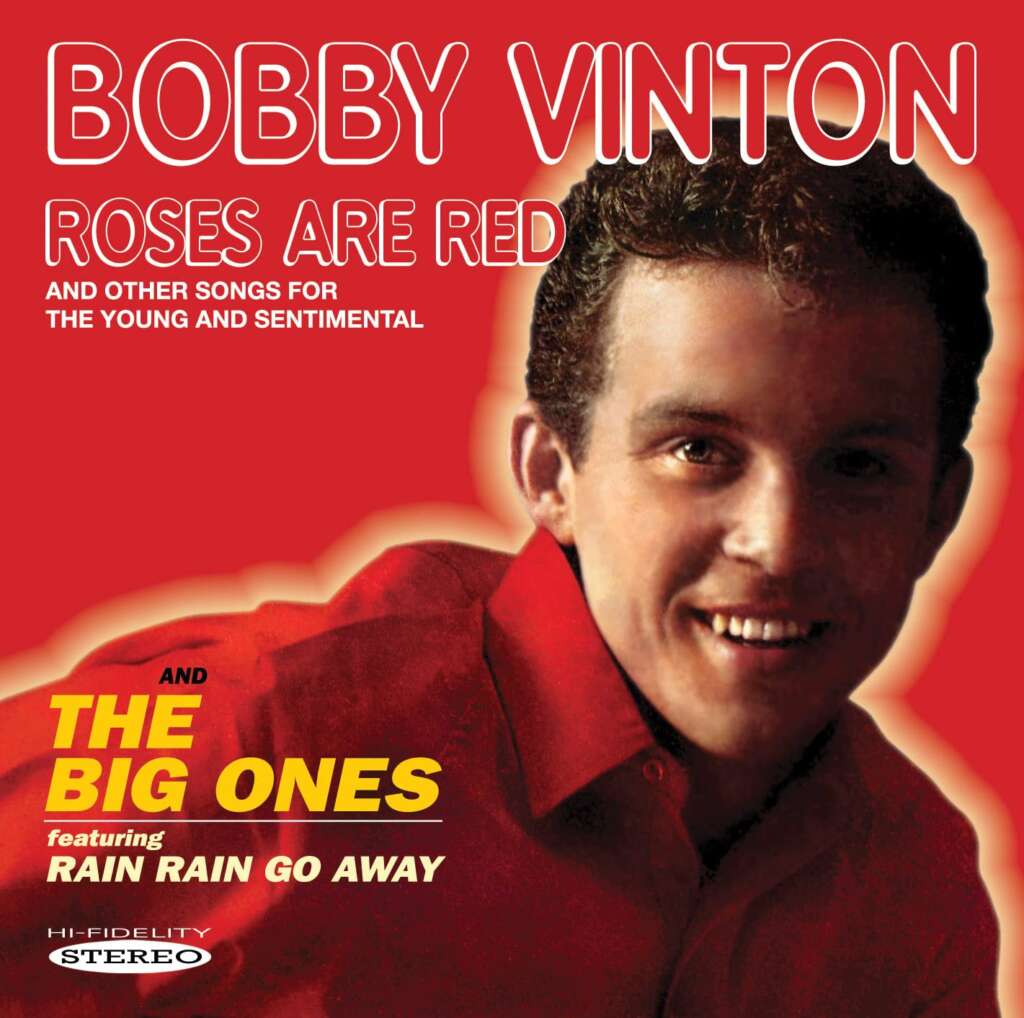 The album cover features a cheerful person in a red shirt against a red background. Bold red and white text reads, "Bobby Vinton, Roses Are Red and other songs for the young and sentimental," and "The Big Ones featuring Rain Rain Go Away." Label mentions "Hi-Fidelity Stereo.