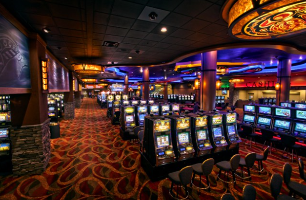 A room with slot machines and chairs