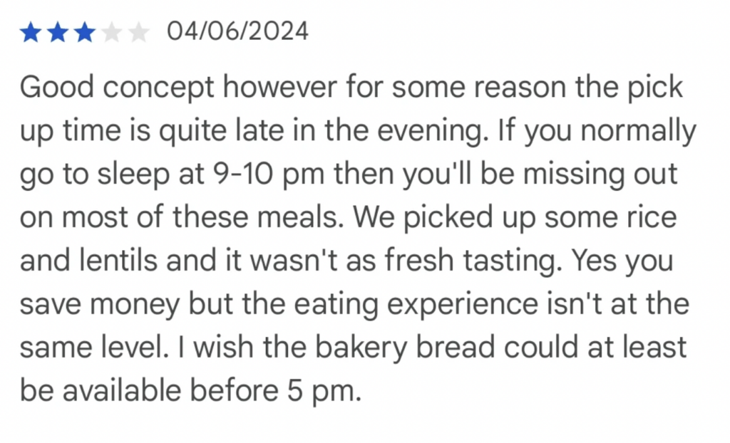A review rating with two and a half stars, dated 04/06/2024. The reviewer mentions the late pick-up time (9-10 pm), affecting meal freshness, specifically mentioning rice and lentils. They appreciate the cost savings but prefer bakery bread to be available before 5 pm.