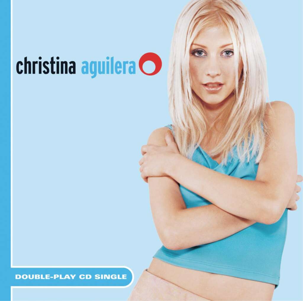 Cover of Christina Aguilera's double-play CD single. The image features Christina Aguilera with long blonde hair, wearing a blue sleeveless top, crossing her arms against a light blue background. The text includes her name and "Double-Play CD Single.