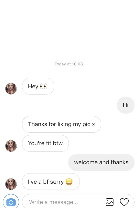 A chat conversation on a messaging app. The first user greets with "Hey" and a double eye emoji, followed by thanking the second user for liking their photo, complimenting them, and apologizing for having a boyfriend with a sad face emoji. The second user responds with "Hi" and "welcome and thanks.