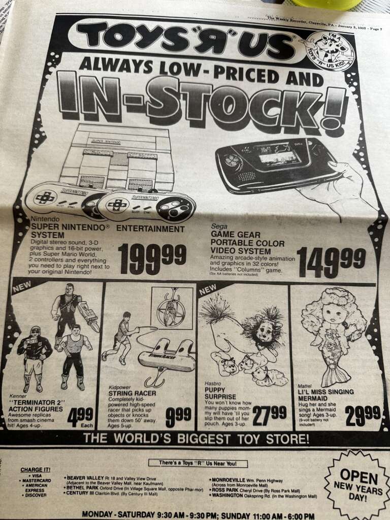 A vintage Toys R Us newspaper advertisement featuring various toys and electronics. Offers include a Super Nintendo System for $199.99, Sega Game Gear for $149.99, Terminator 2 action figures for $4.99 each, and more. The slogan "Always low-priced and in-stock!" is prominently displayed.