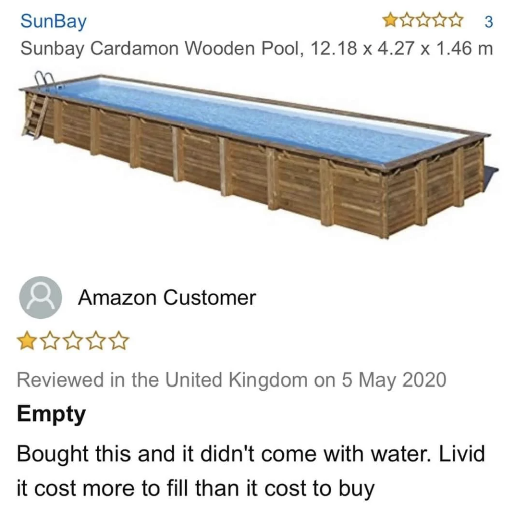 The image shows an online review for the SunBay Cardamon Wooden Pool (12.18 x 4.27 x 1.46 meters). The pool is rectangular and above ground. The reviewer gave 1 star, stating that it was empty upon delivery and cost more to fill with water than to purchase.