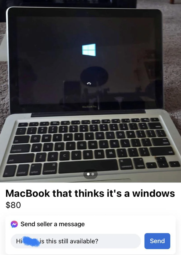 A MacBook laptop is displaying the Windows logo on its screen, indicating it is running a Windows operating system. The listing title reads, "MacBook that thinks it's a windows," and the price is $80. A user message asking if it's still available is shown below.