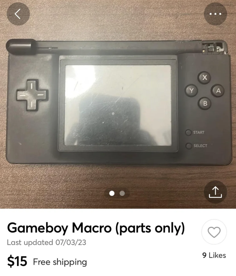 A black Gameboy Macro with visible wear on its screen. The device appears to be missing some parts. Listed for $15 with free shipping, the post has 9 likes. The text states "Gameboy Macro (parts only)" and mentions the last update was on 07/03/23.