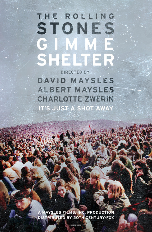 Poster for the film "The Rolling Stones: Gimme Shelter" depicting a large outdoor crowd at a concert. The text reads, "THE ROLLING STONES GIMME SHELTER, Directed by David Maysles, Albert Maysles, Charlotte Zwerin. It's Just a Shot Away," with film credits at the bottom.