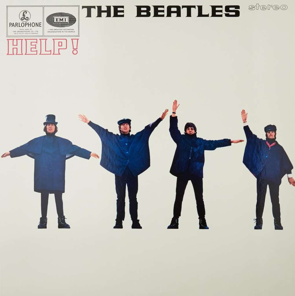 Album cover for "Help!" by The Beatles. It features the four band members standing in blue coats, each lifting their arms to spell out a semaphore code. The background is white with album text logos at the top left and "HELP!" in red letters on the left side.