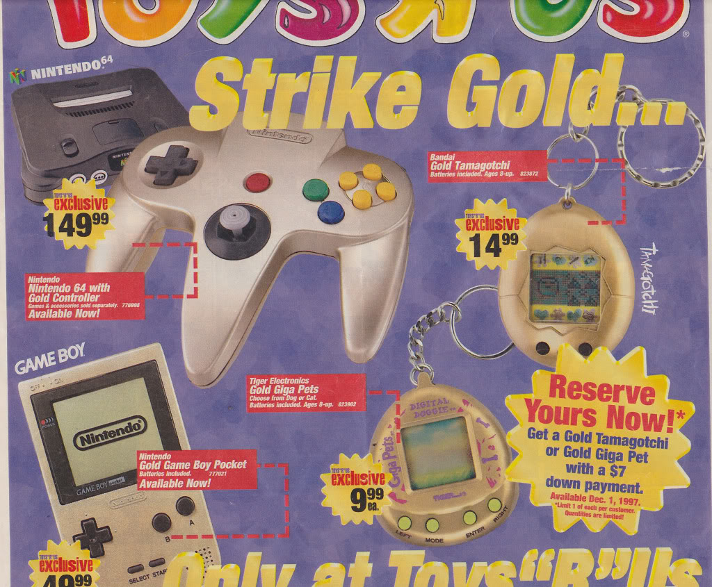 An advertisement for Toys "R" Us featuring Nintendo 64, Game Boy Pocket, and Tamagotchi products. Items include a Nintendo 64 controller, golden Tamagotchi, gold Game Boy Pocket, and Giga Pets. Prices listed range from $14.99 to $64.99. Promo slogan: "Strike Gold!”