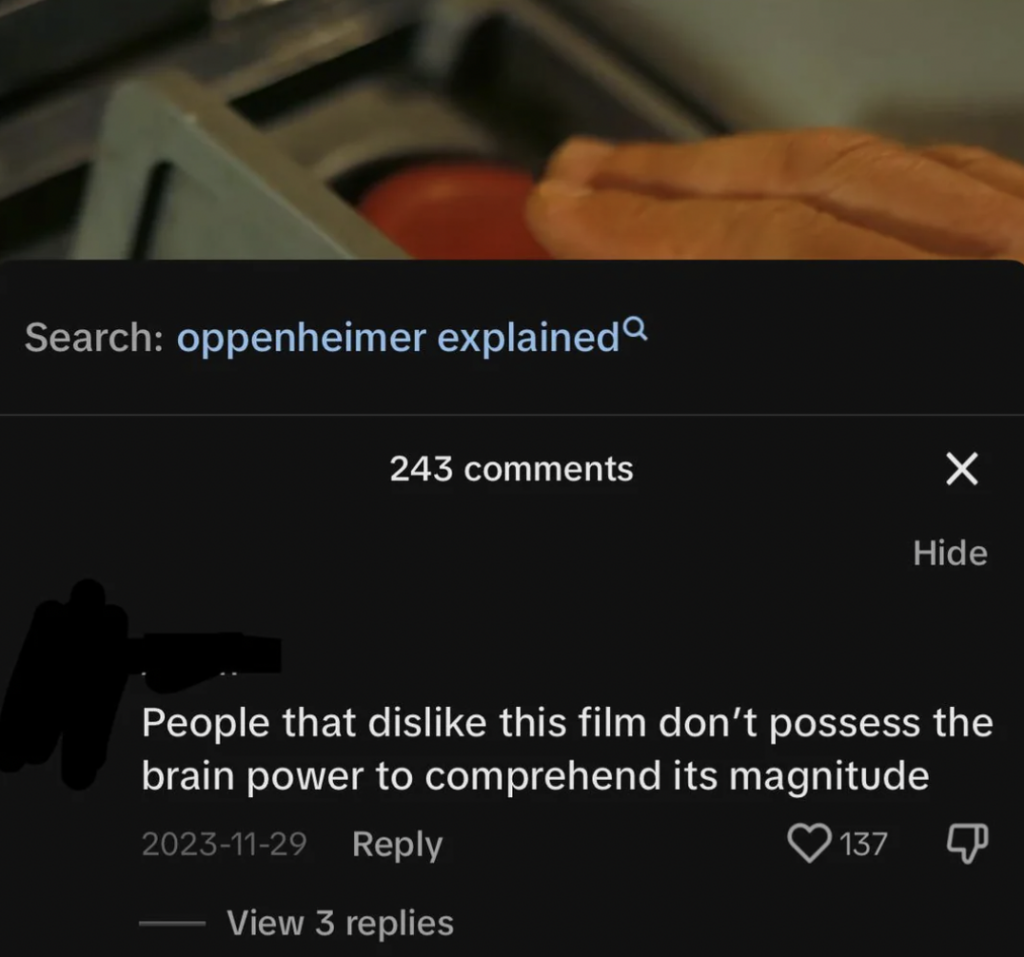 A screenshot shows someone typing "oppenheimer explained" in a search bar. Below, there's a comment with 243 replies stating, "People that dislike this film don’t possess the brain power to comprehend its magnitude." It has 137 likes and 3 replies.