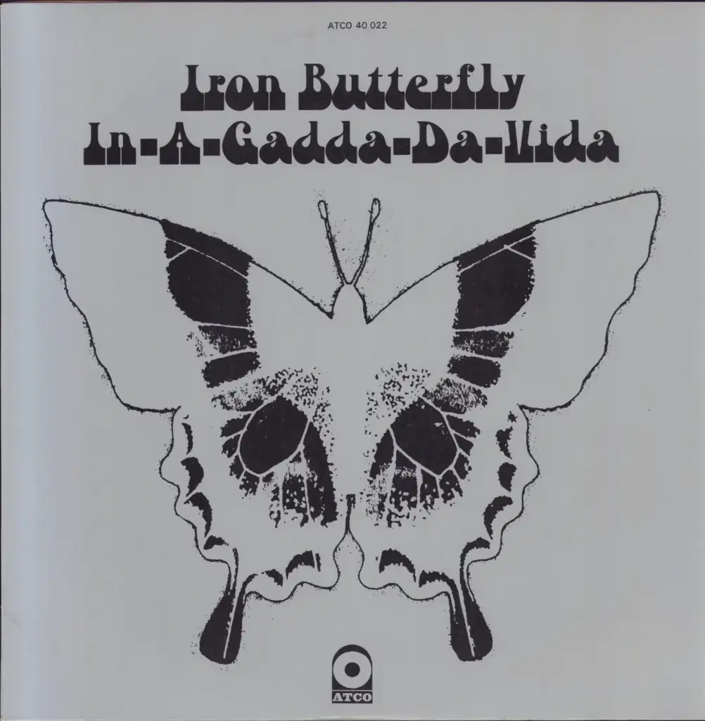 A black and white illustration of a butterfly is centered on a plain background. Above the butterfly, stylized text reads "Iron Butterfly In-A-Gadda-Da-Vida." At the bottom, the ATCO Records logo is displayed.