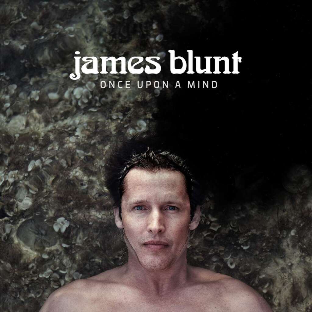 Album cover for "Once Upon a Mind" by James Blunt. The cover features the artist submerged in water, visible from the chest up, with a neutral expression. His name appears in large white text at the top, with the album title below in smaller text.