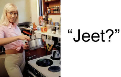 A woman with long blonde hair, wearing a pink shirt and beige pants, stands in a kitchen while stirring a pot on the stove. Various kitchen items are visible around her. To the right, large text reads, "Jeet?
