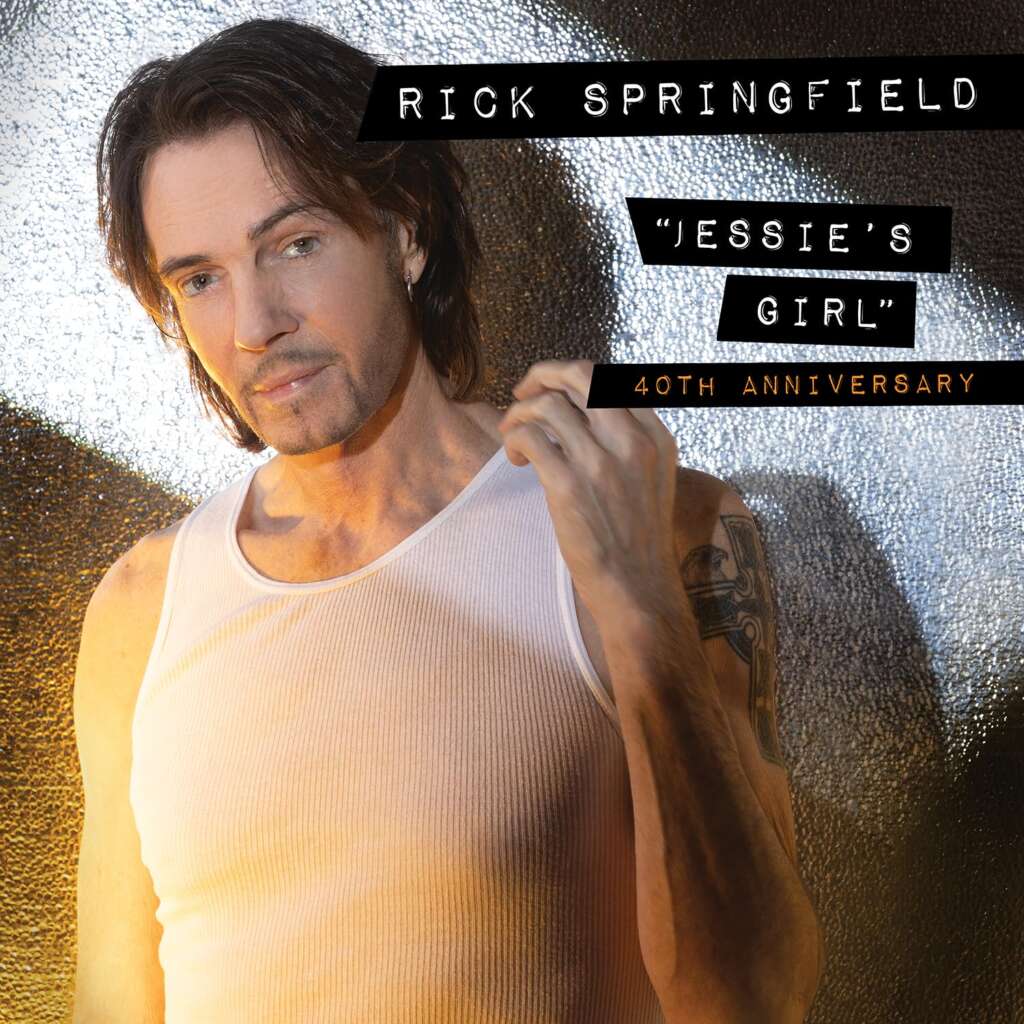 A man in a white tank top poses with an intense gaze against a textured metallic background. Text on the image reads "Rick Springfield 'Jessie's Girl' 40th Anniversary." His left arm displays a visible tattoo.