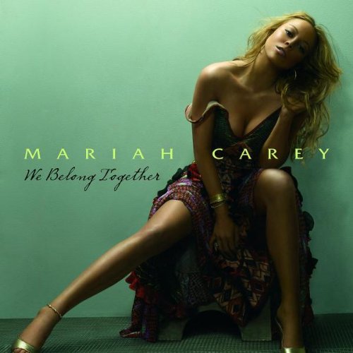 Image of an album cover featuring a woman sitting against a wall. She is wearing a patterned dress that partially reveals her shoulders. The text "Mariah Carey" and "We Belong Together" is written on the cover. The background is a plain teal color.