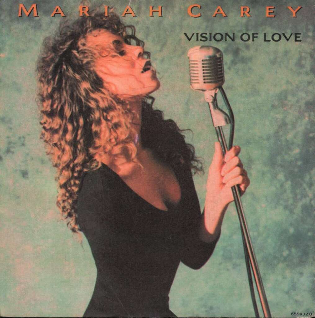 The cover of Mariah Carey's single "Vision of Love" shows her singing passionately into a vintage microphone. She has curly hair and is wearing a black outfit. The background is a textured green-blue, and the title "VISION OF LOVE" is in capital letters at the top.