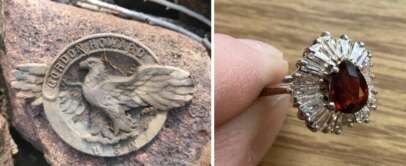 Left: A round metal badge on a rock, featuring an eagle and the words "Gordon Holland U.S." Right: A hand holding a silver ring with a central red gemstone surrounded by clear, baguette-cut stones in a starburst pattern.