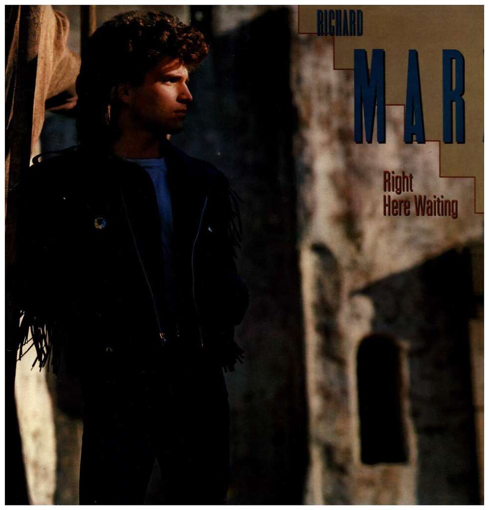 A person with curly hair stands in partial shadow, wearing a dark jacket with fringe. The background has textured, ancient-looking walls. The text on the right reads "RICHARD MARX Right Here Waiting.