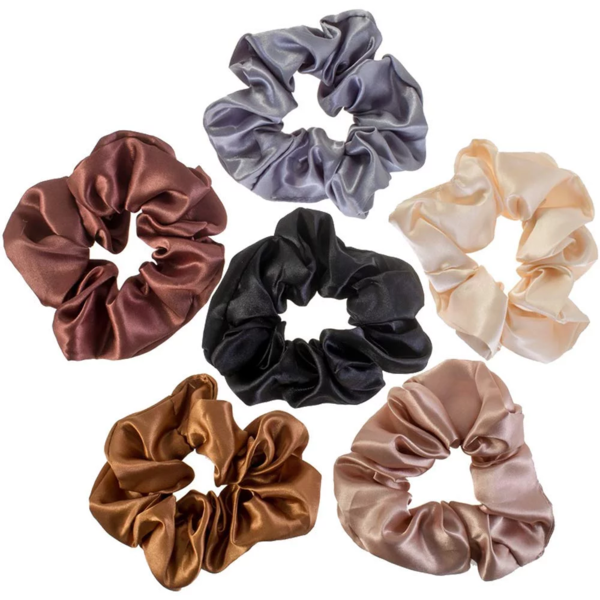 Six satin scrunchies are arranged in a circle. The scrunchies are in different colors: purple, beige, pink, black, brown, and orange. Each scrunchie has a glossy and smooth appearance, highlighting the satin material.