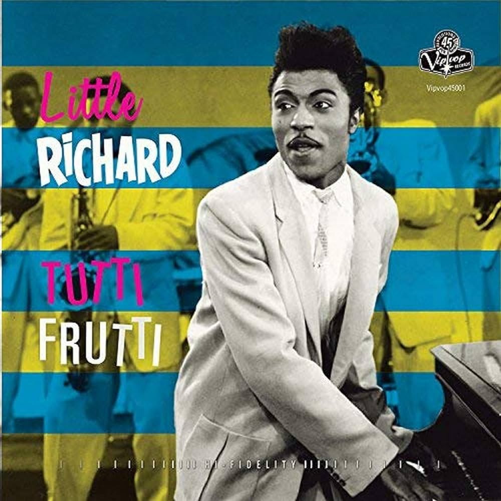 Album cover featuring a musician in a white suit playing a piano. The background has a blue and yellow striped pattern with silhouetted musicians. Text on the cover includes "Little Richard" in pink and white and "Tutti Frutti" in pink and blue.