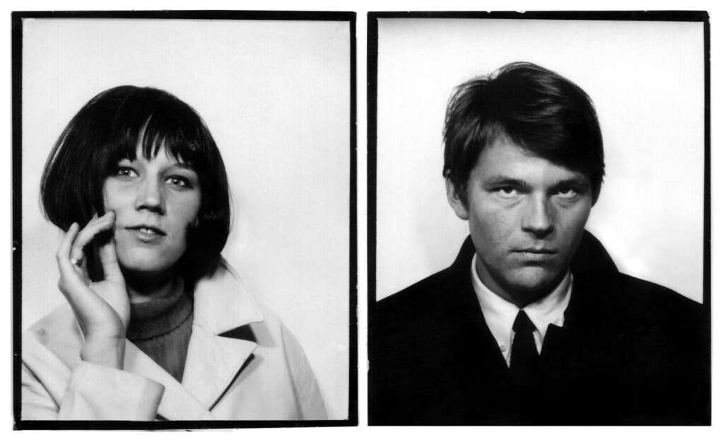 Two black-and-white portrait photographs side-by-side. The photo on the left features a person with short, dark hair touching their face and wearing a light-colored coat. The photo on the right shows a person with short, dark hair wearing a dark suit and tie.