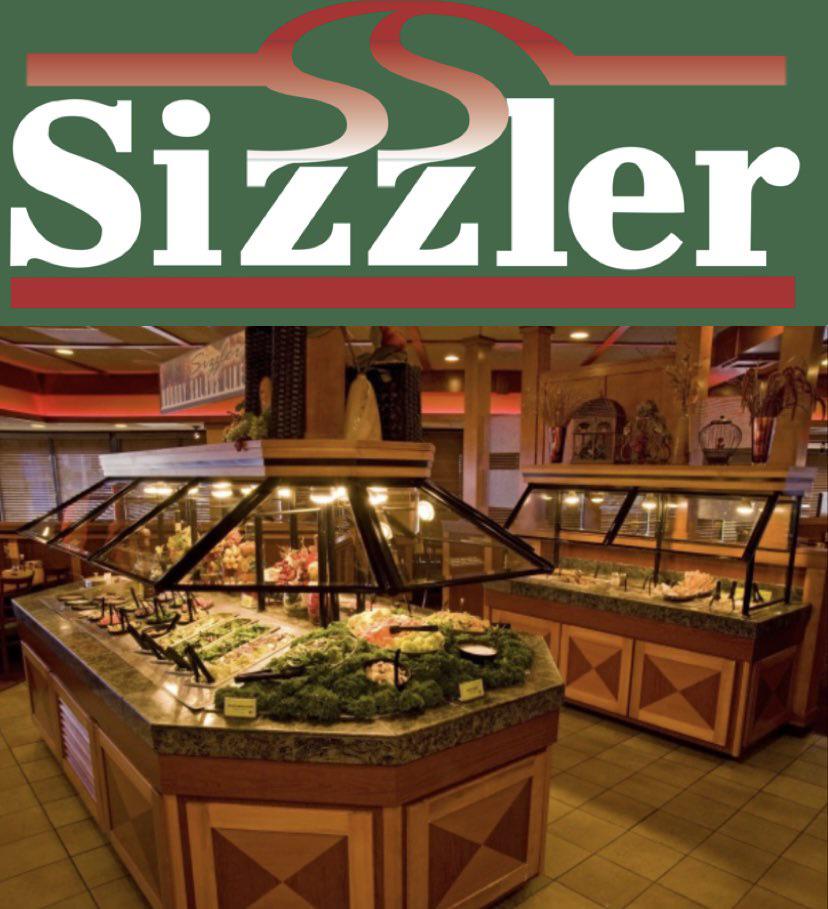 A buffet area is shown inside a Sizzler restaurant. The buffet features various food items under protective glass coverings. The restaurant's interior is warmly lit, with wood and tile decor. At the top, the Sizzler logo is prominently displayed.