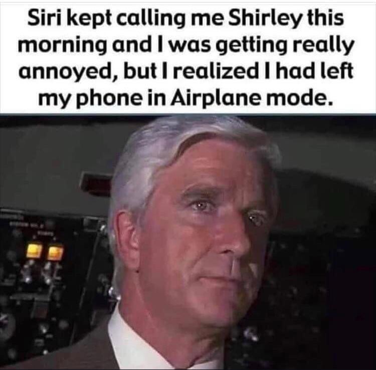 A scene from a classic film, with a man in a suit looking serious. Above him, text reads, "Siri kept calling me Shirley this morning and I was getting really annoyed, but I realized I had left my phone in Airplane mode.