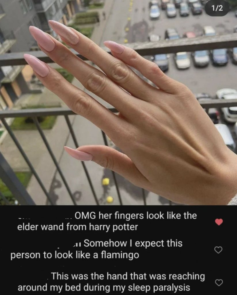 A hand with long, manicured nails painted a light pink is shown against a blurred background of a street with buildings and parked cars. A few humorous comments are overlaid on the image, referencing the hand's appearance and comparing it to various objects and scenarios.