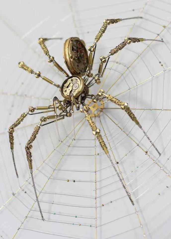 A steampunk-style spider crafted from clockwork gears and intricate metal parts intricately stands on its web composed of fine, metallic threads. The overall look is both mechanical and artistic, merging nature with vintage machinery design.