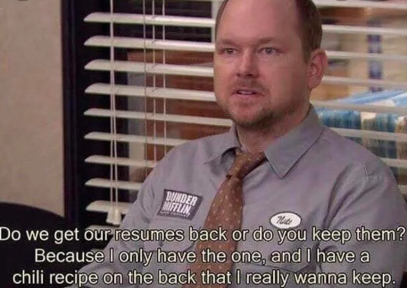 A man sits in an office wearing a shirt with the name tag "Nate" and a "Dunder Mifflin" logo. A caption reads: "Do we get our resumes back or do you keep them? Because I only have the one, and I have a chili recipe on the back that I really wanna keep.