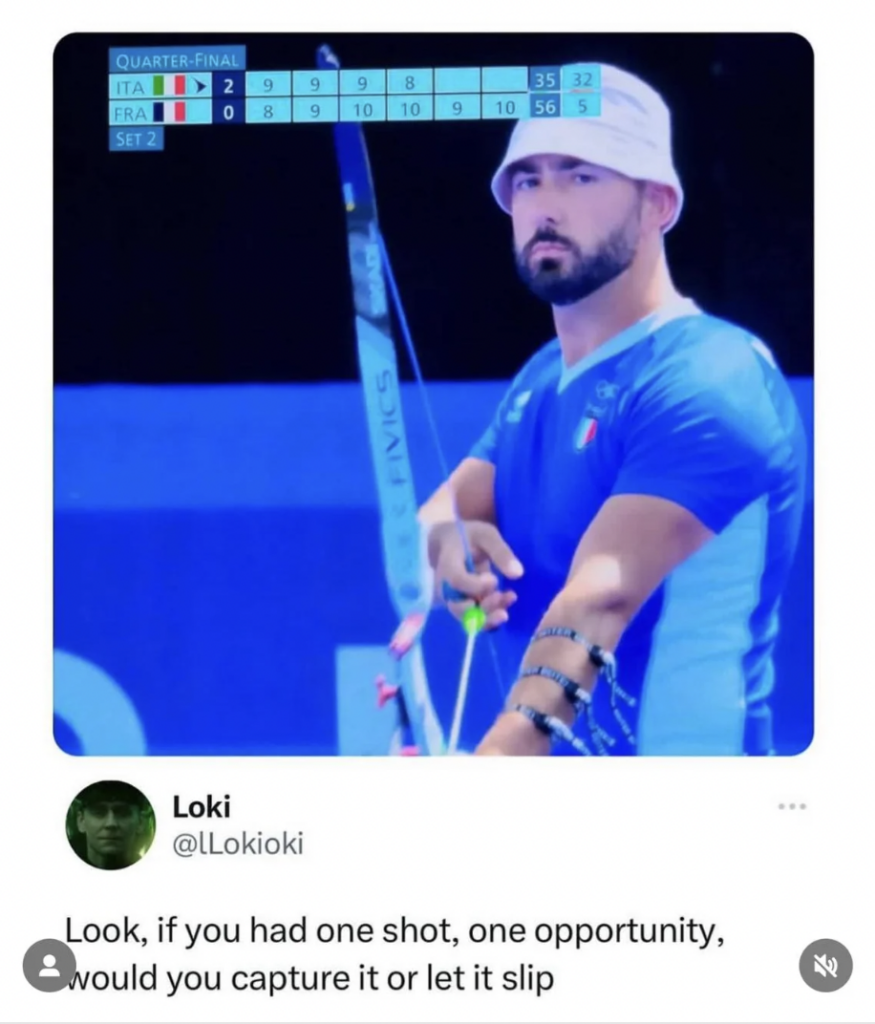 A male archer in a white bucket hat, blue sportswear, and armguard prepares to draw his bow at an archery competition. The scoreboard shows a 2-2 tie with scores of 9 and 10. A tweet below it quotes "Look, if you had one shot, one opportunity, would you capture it or let it slip".