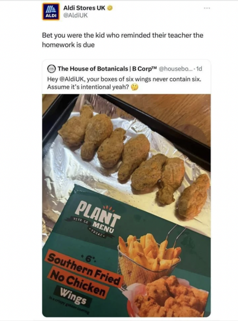 A tweet by Aldi Stores UK showing a response to a complaint about missing wings in a "Plant Menu Southern Fried No Chicken Wings" box. The image displays four plant-based wings on a tray beside the open box, which claims to contain six wings.