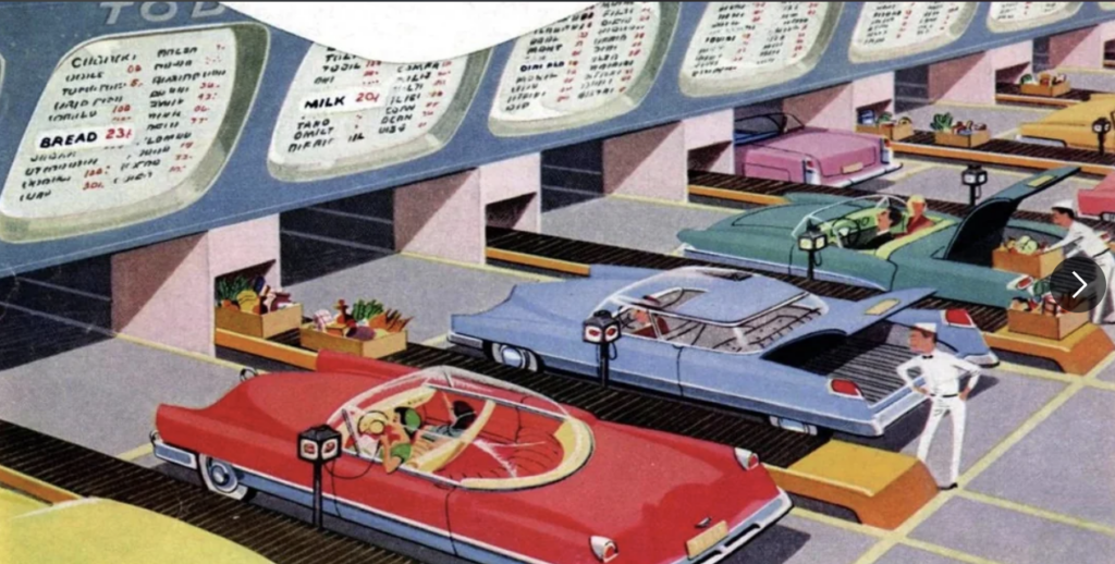 A futuristic drive-through grocery store with colorful retro cars in shopping lanes. Shoppers remain seated in their cars while items are placed on conveyors and directed to their vehicles. A uniformed attendant stands nearby, ready to assist.