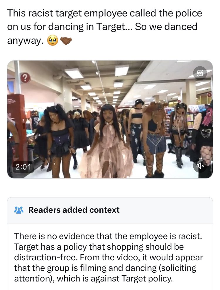 A group of people in colorful clothing are dancing inside a Target store. The text above the image claims that a Target employee called the police on them for dancing, while additional context below the image states that filming and dancing are against Target policy.