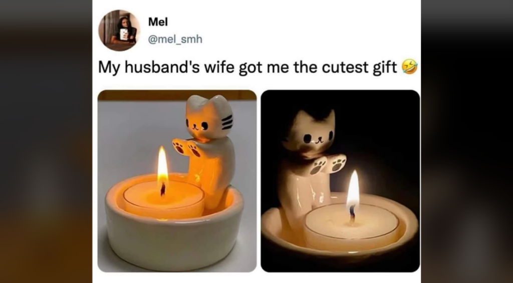 A tweet from a user named Mel shows two images of a ceramic cat-shaped candle holder. The left image shows the holder lit in daylight, displaying a white ceramic cat holding a small candle. The right image shows the same holder in darkness, illuminated by the candle. The tweet's caption reads, "My husband's wife got me the cutest gift," followed by a smiling face with a hand over the mouth emoji.