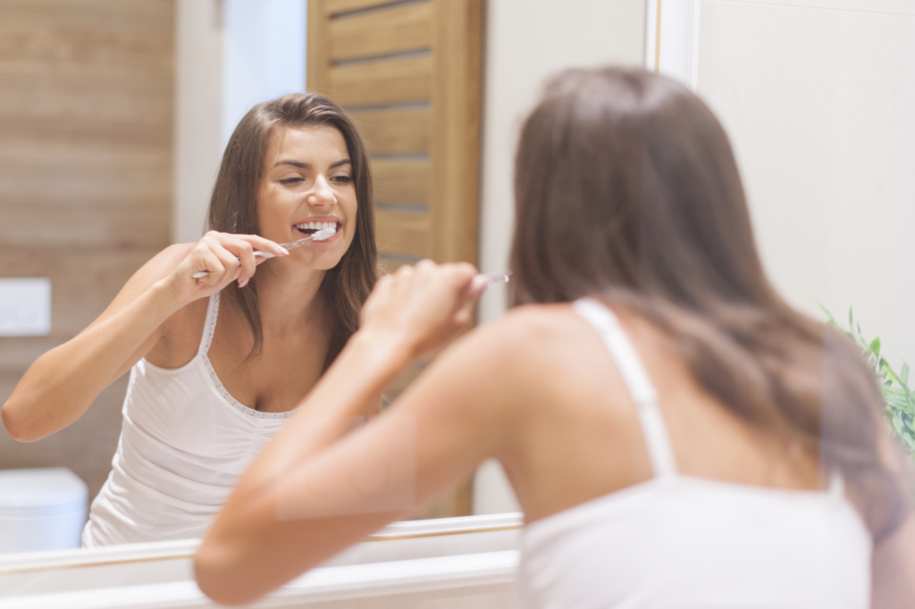 Body Life hacks - Woman brushing your teeth while alternating which foot she's standing on to relieve ankle pain