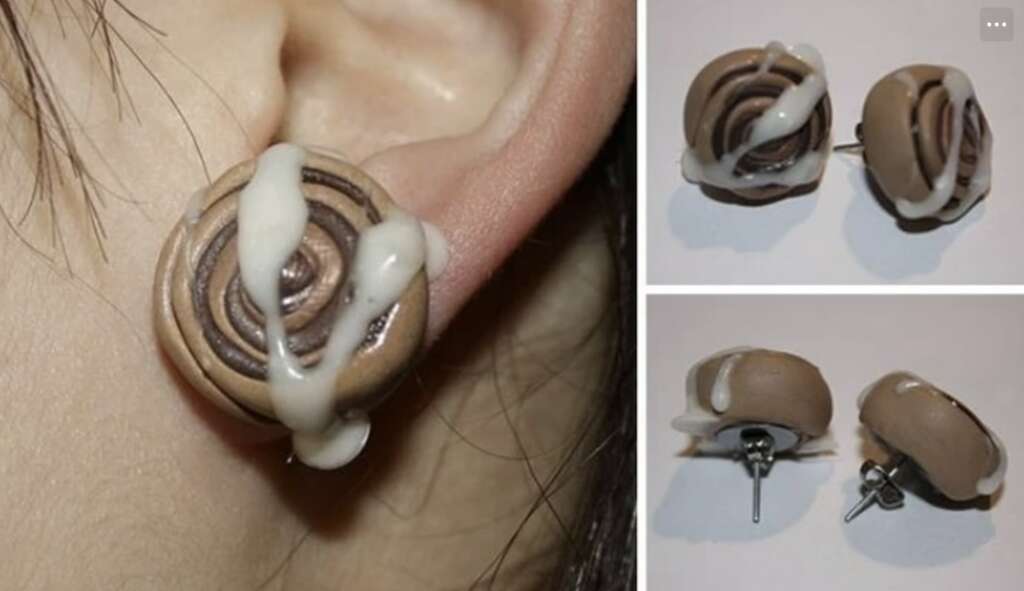 Close-up of a person's ear wearing a brown earring shaped like a cinnamon roll with white icing. Additional views show two cinnamon roll earrings from the front and side, highlighting their small stud design.