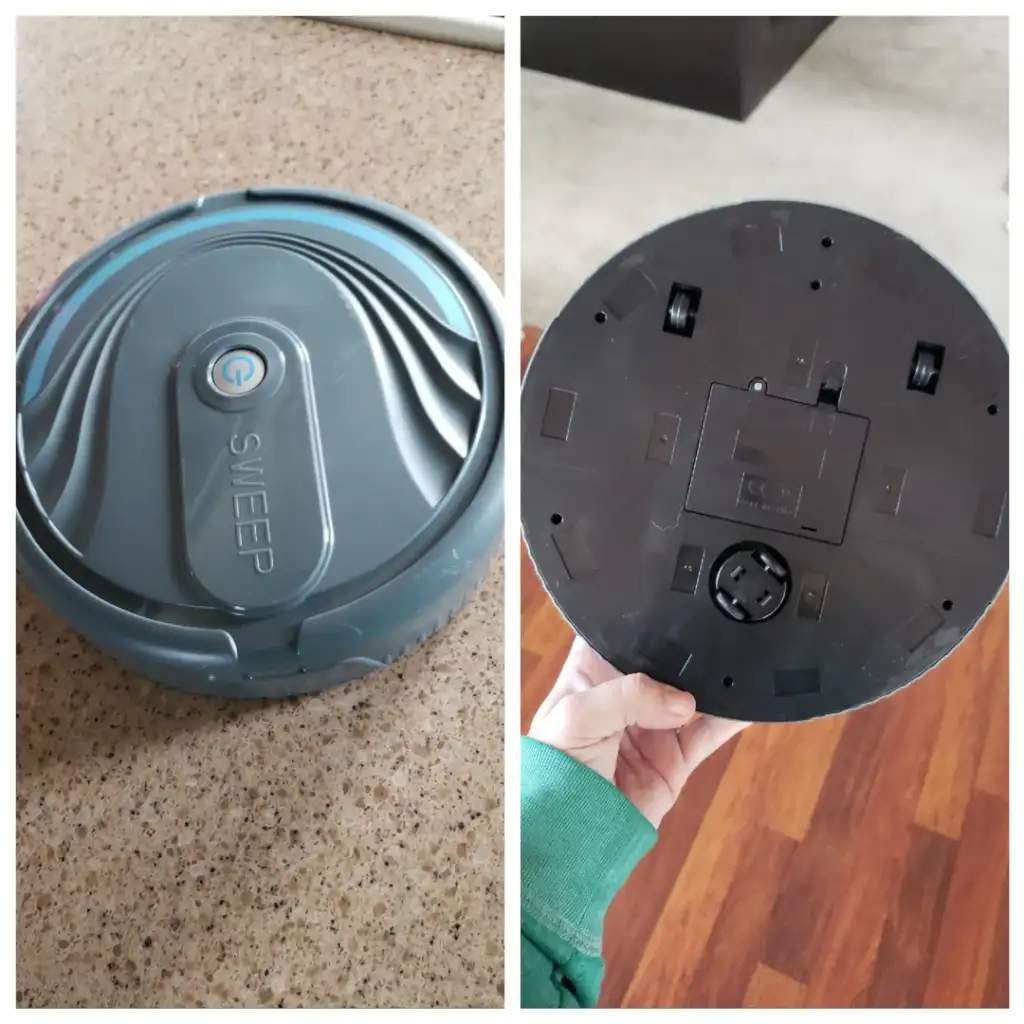 Two images of a circular robotic vacuum, labeled "Sweep" on top. The left image shows the top view with a power button. The right image shows the underside, revealing wheels and a compartment. The vacuum is held by a hand over a wooden floor.