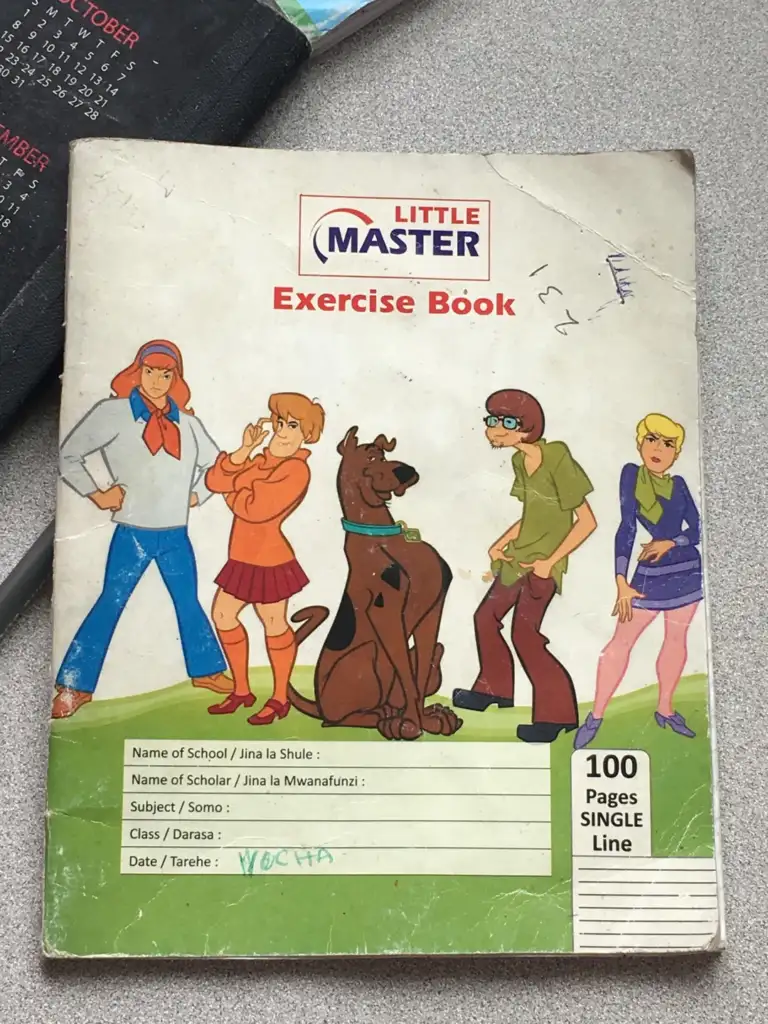 An exercise book cover featuring cartoon characters in detective attire. The background has a text form with fields for school name, student name, subject, class, and date. The book is labeled "Little Master" and has 100 pages, single line.