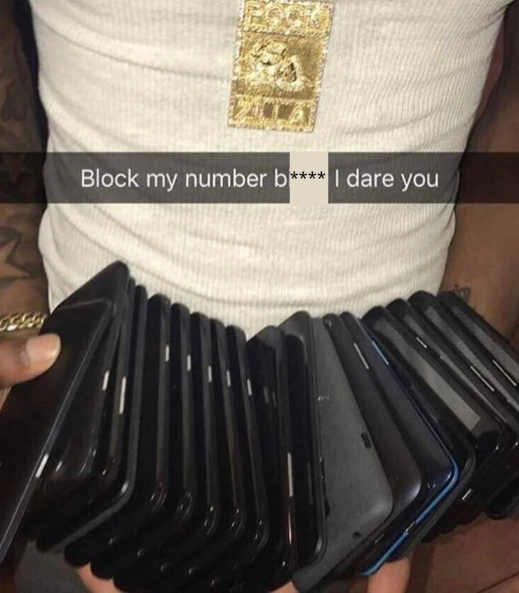 A person wearing a gold necklace holds multiple smartphones, stacked in their arms. The overlay text reads, "Block my number b**** I dare you.