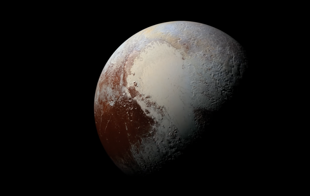 A detailed image of Pluto showing varied regions with shades of brown and white, highlighting its icy surface and unique heart-shaped formation. The planet is set against a black background, emphasizing its textured appearance.