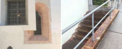 The image is divided into two sections. The left shows a barred window set in a white wall with a small opening. The right section shows stairs partially blocked by a brick wall, with a handrail on the opposite side.