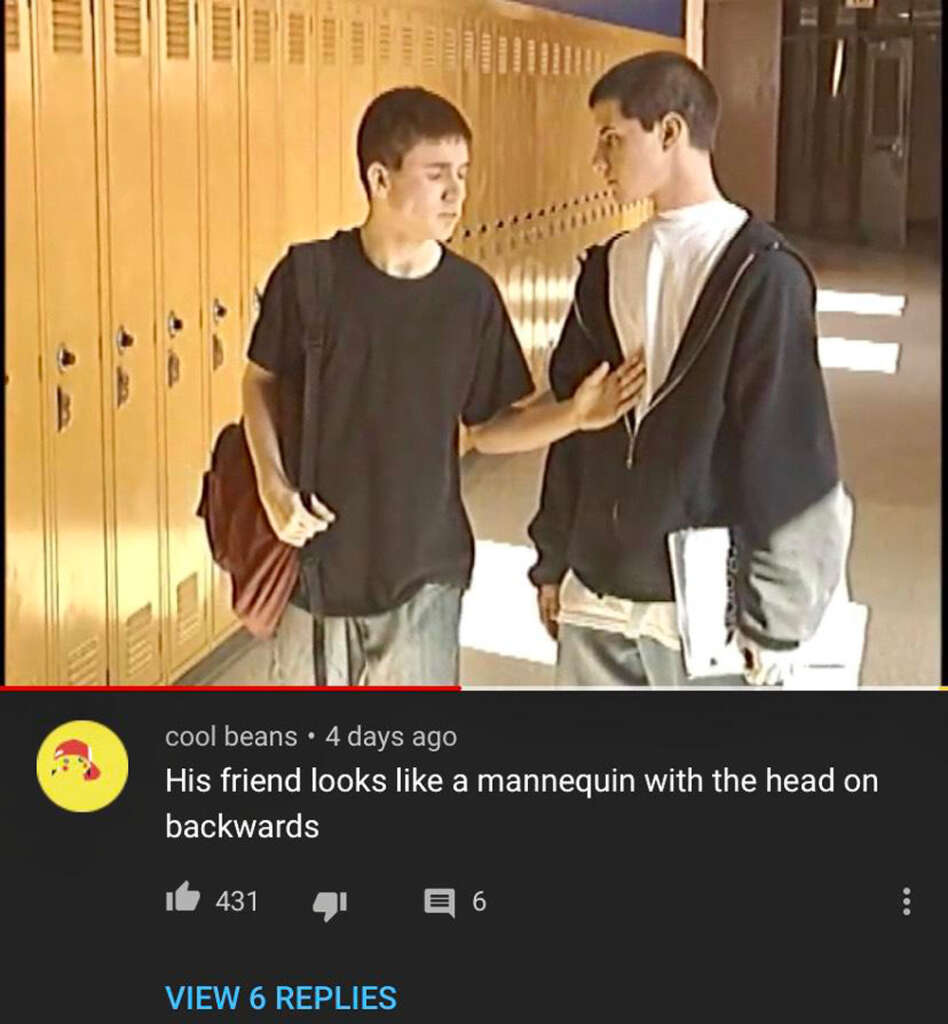 Two teenagers in a school hallway face each other. One has his hand on the other's chest, both with casual expressions. They are surrounded by yellow lockers. A humorous comment below mentions one looks like a mannequin with the head on backwards.