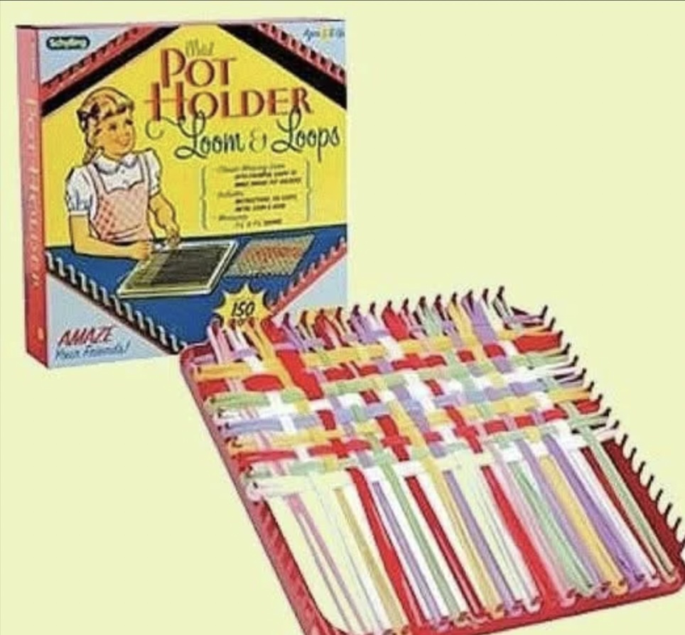 A vintage pot holder loom kit with loops is shown. The open box displays assorted colorful loops on a loom. The package features an illustration of a person weaving and includes text about the product.