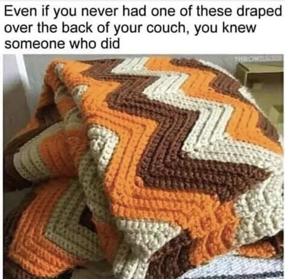 A crocheted afghan with a zig-zag pattern in orange, brown, and cream draped over the back of a couch. The image includes text about familiarity with such blankets.