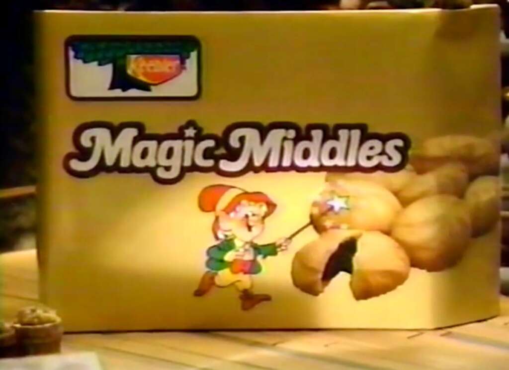 A box of Keebler Magic Middles cookies with an illustration of an elf holding a magic wand. The box features an image of the cookies with one cookie showing a filling inside.