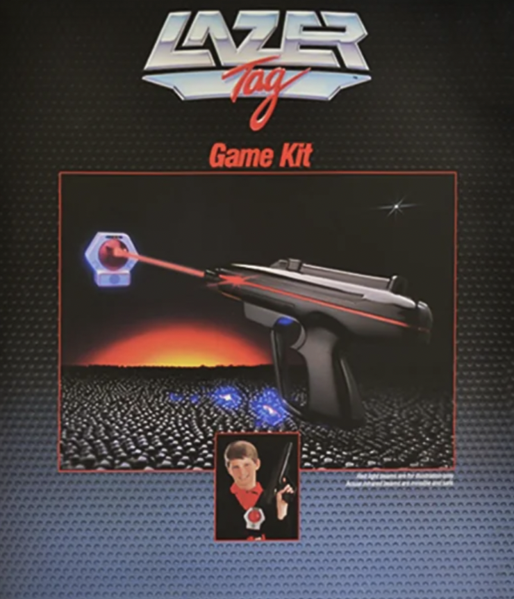 Cover of a Lazer Tag Game Kit with an image of a laser gun shooting a red beam. Background features a futuristic landscape with a glowing horizon. Below is a smaller inset photo of a person wearing a Lazer Tag gear.