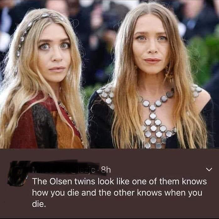 Two women with long hair wearing stylish outfits at an event. A tweet below the image humorously comments about them, saying one looks like she knows how you die and the other knows when you die.