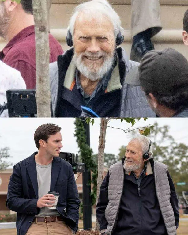 A smiling older man with a white beard is wearing headphones outdoors among a group of people. In a separate image, he is sitting on a bench, talking to a younger man holding a coffee cup. Both scenes appear to be on a film set.