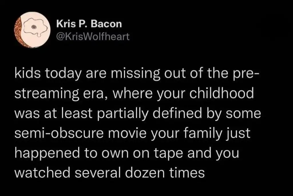 Text post by Kris P. Bacon reads: "kids today are missing out of the pre-streaming era, where your childhood was at least partially defined by some semi-obscure movie your family just happened to own on tape and you watched several dozen times.